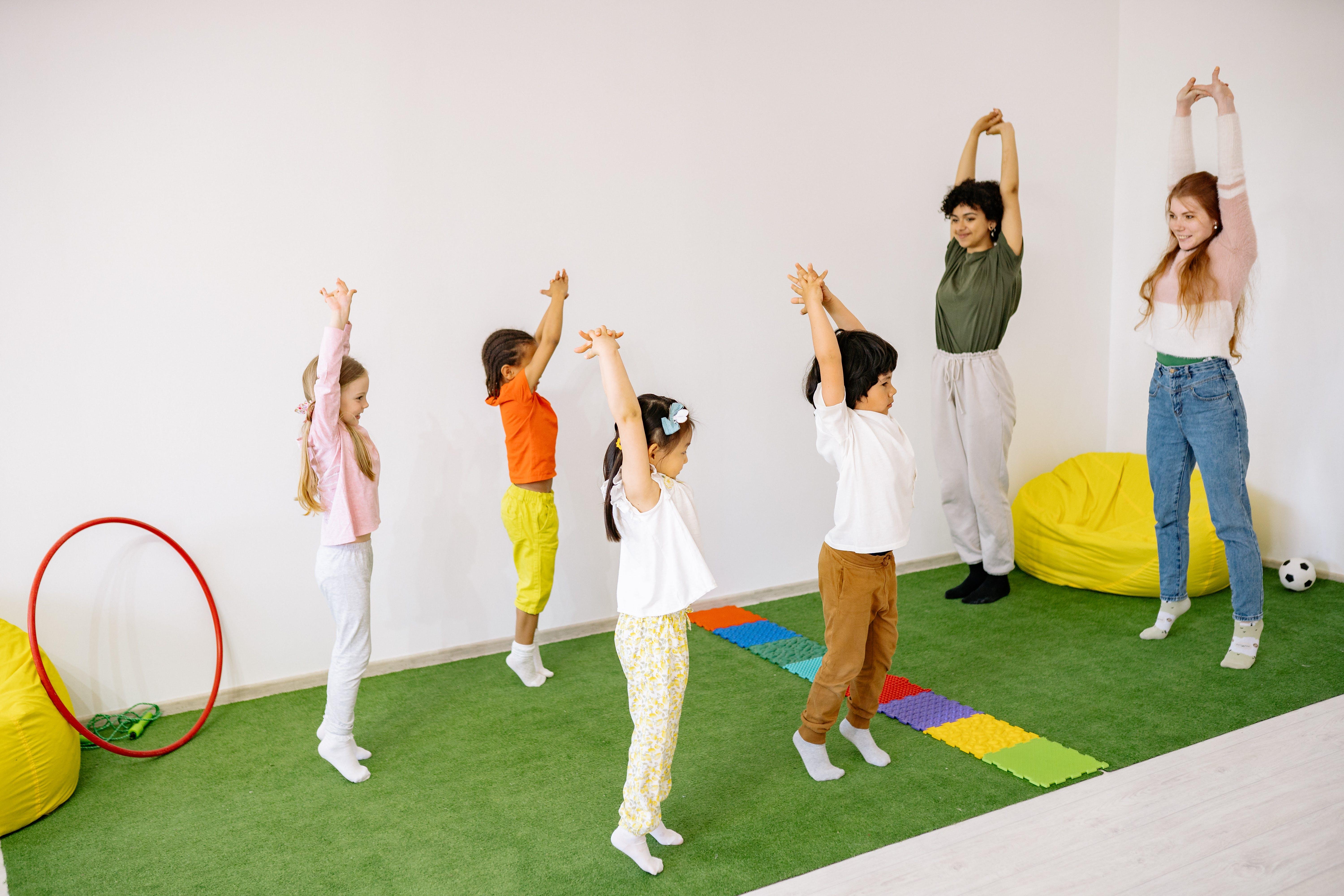 Photograph of children and adults exercising together