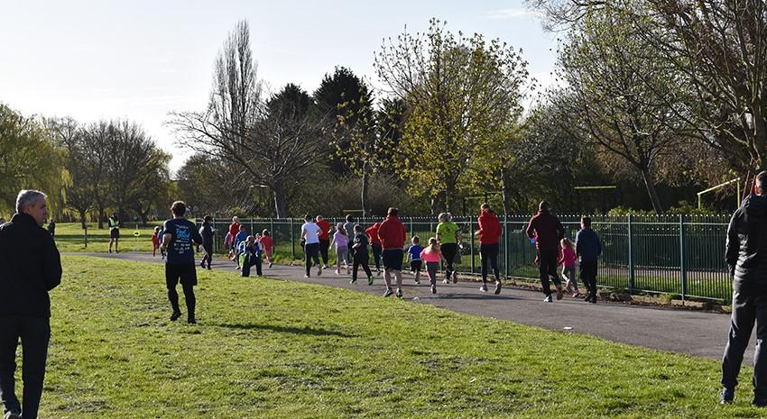 Photograph of people walking in a park