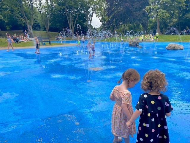 Photograph of children playing in an outdoor paddling pool