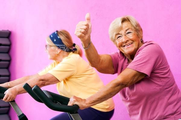 person exercising with their thumbs up