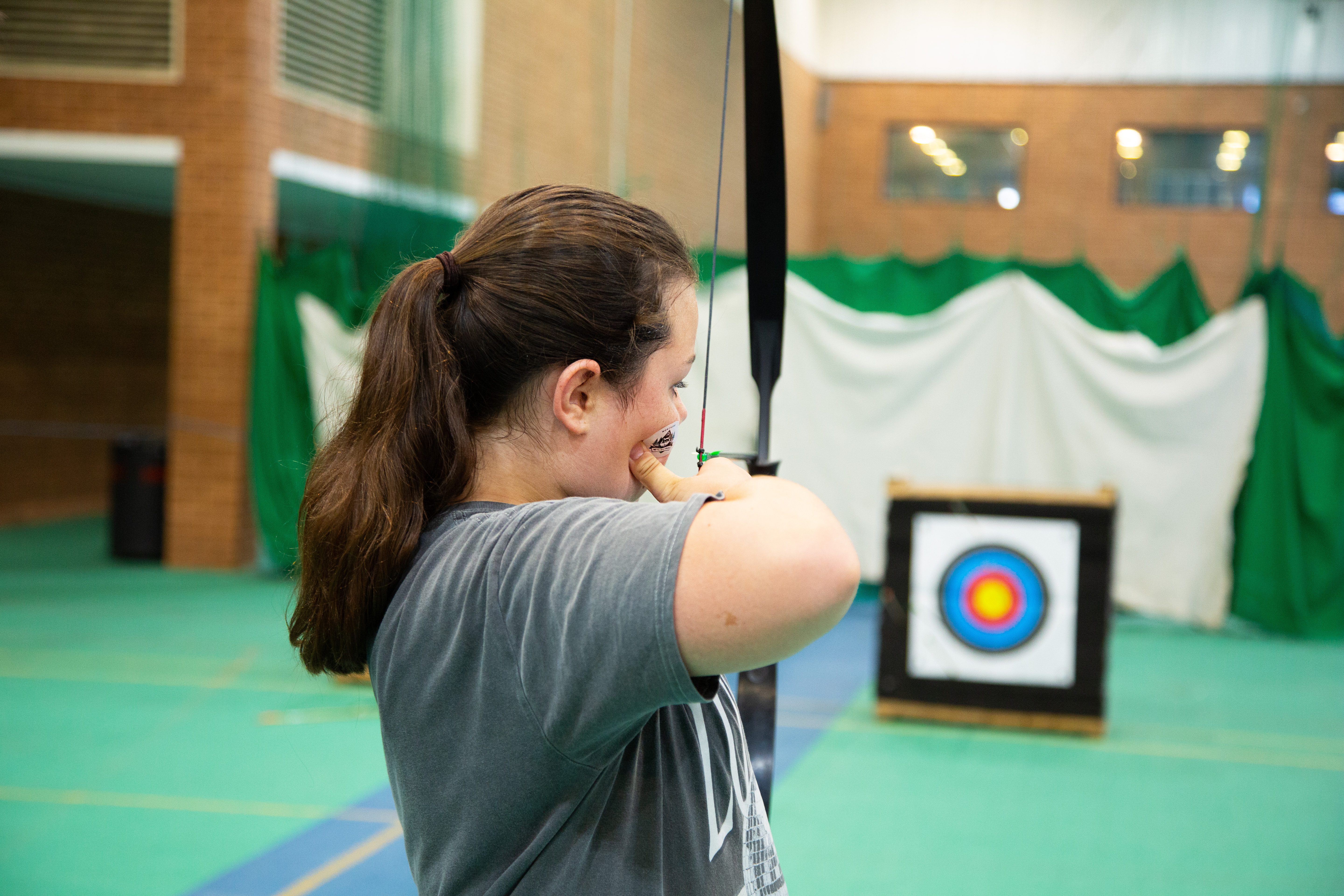 Photo of a girl playing archery