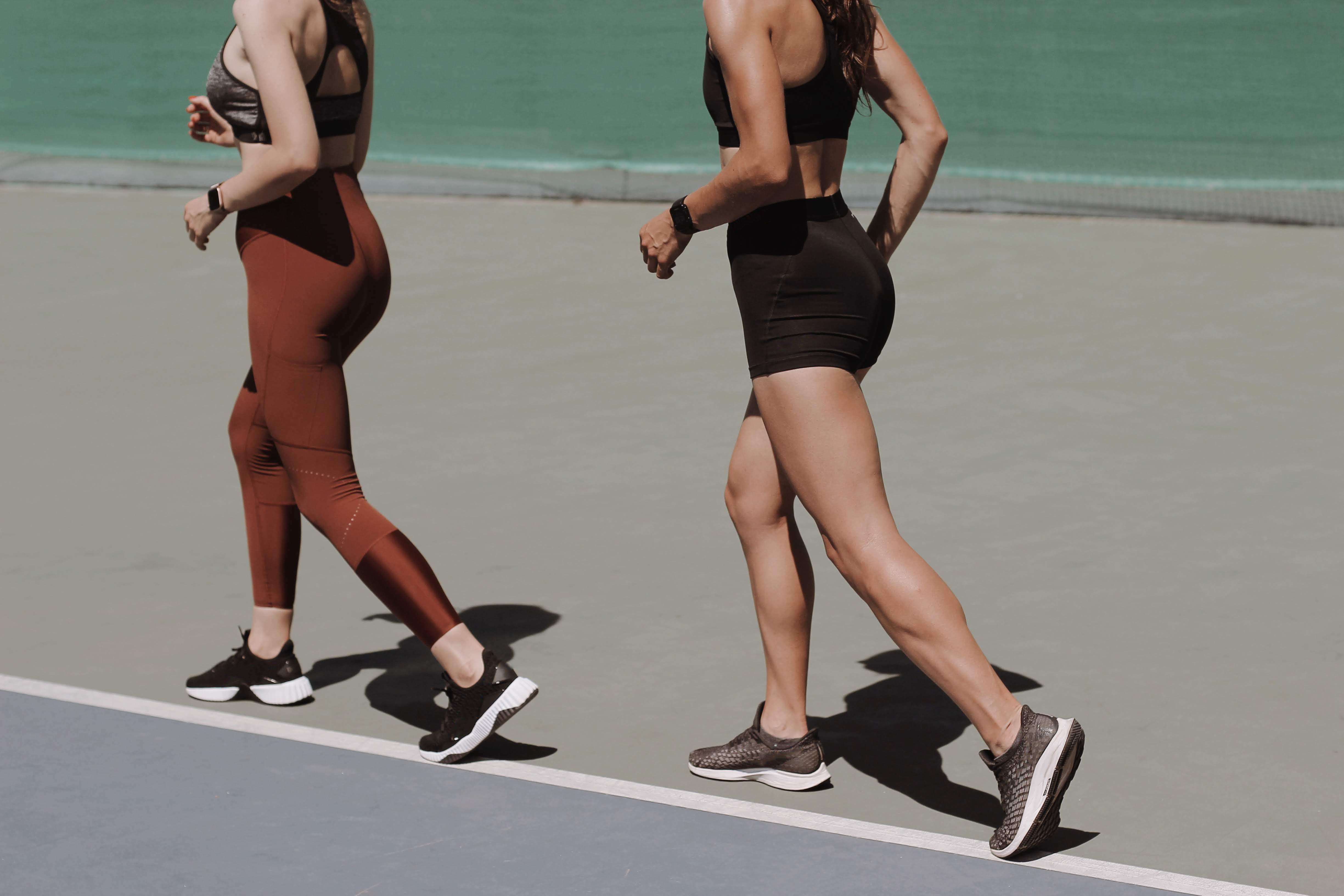 Photograph of 2 women in athletics gear