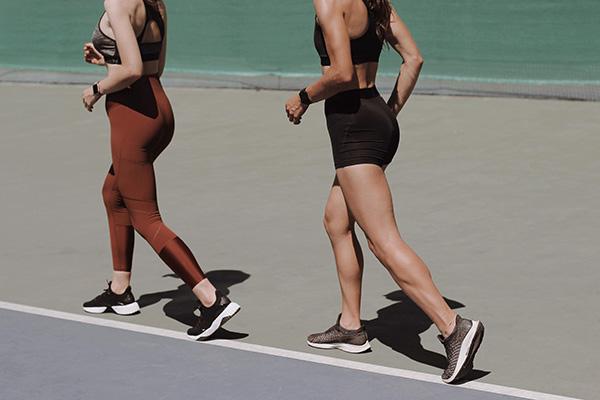 2 women in athletics gear