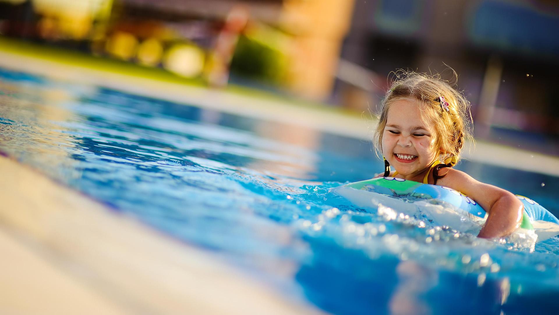 a girl swimming in a pool