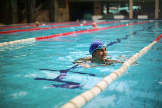 A photograph of a swimmer in a swimming pool